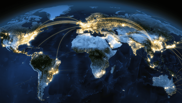 Aerial view of global IoT device network with glowing data streams connecting cities worldwide